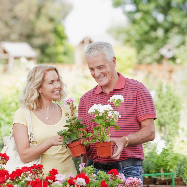 Couple shopping for flowers in nursery